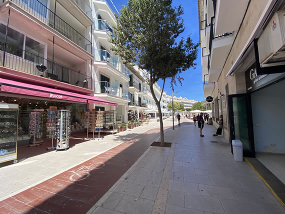 street with shops leading to cala bona harbour
